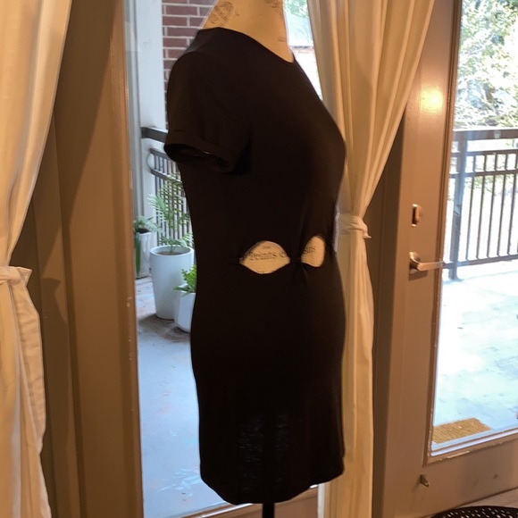 Small black shortsleeve dress with cut outs and knots at stomach waist level​ - Picture 6 of 8